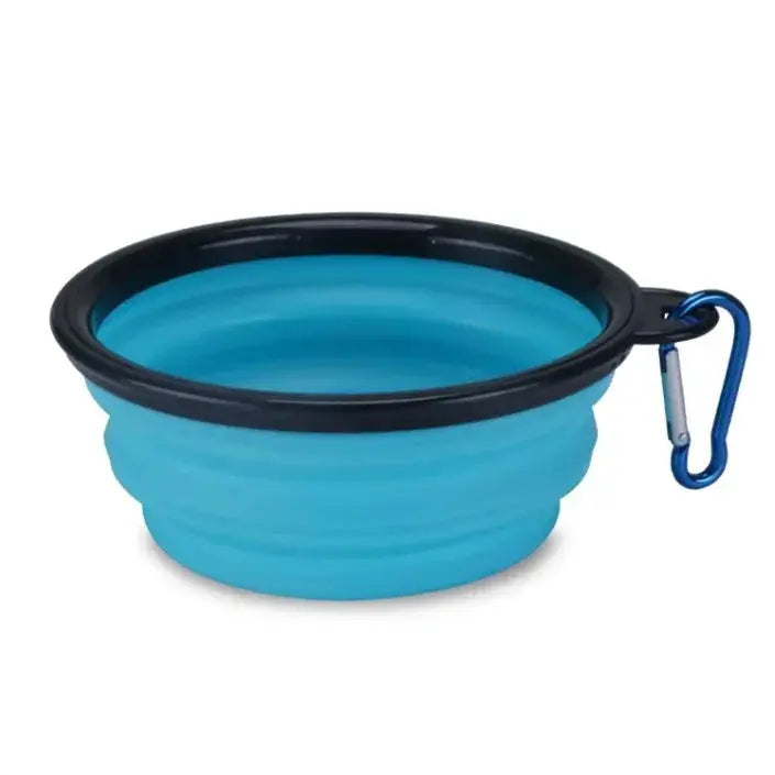 Blue collapsible pet bowl with black rim and blue carabiner on a white background