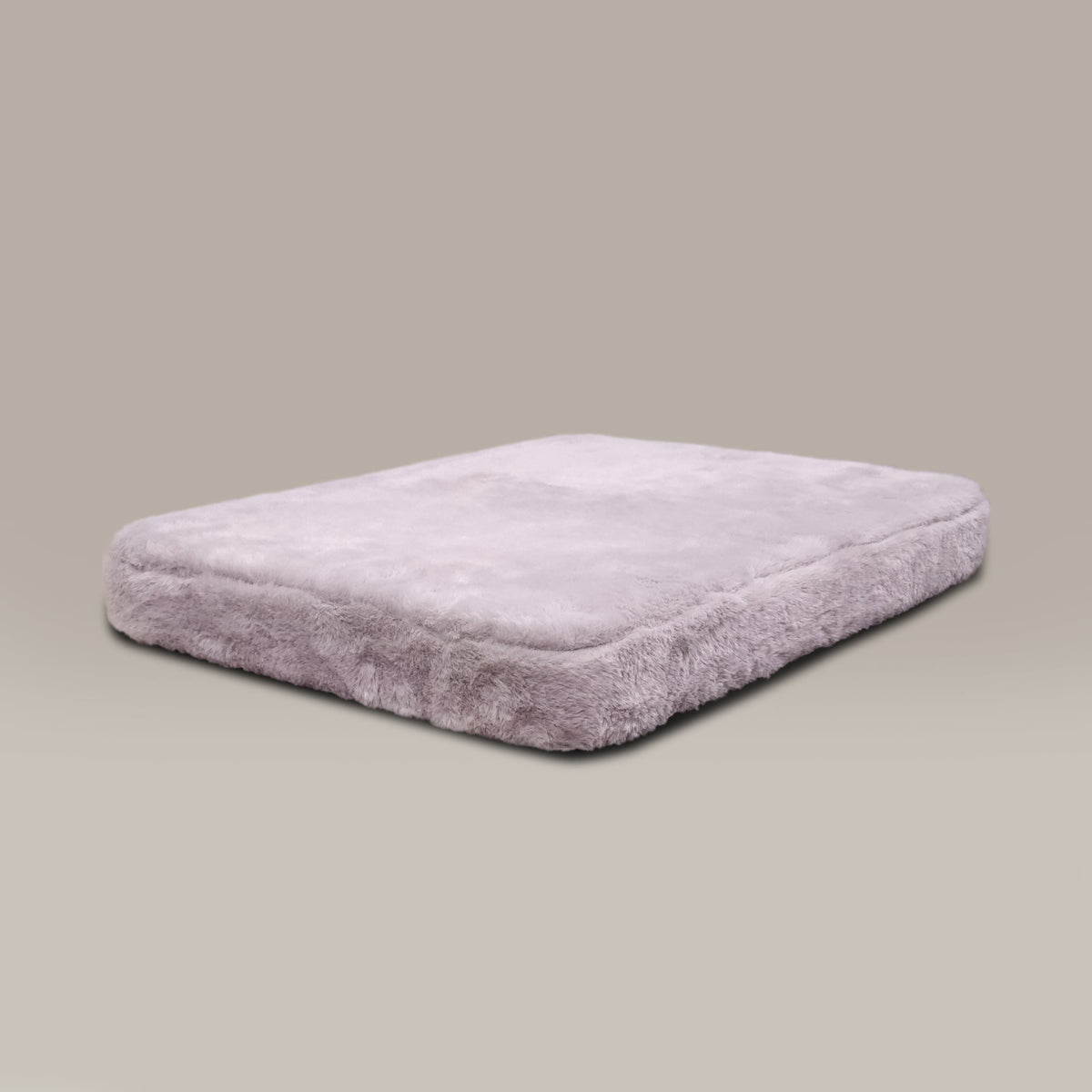 Rectangular gray cushion on a beige background