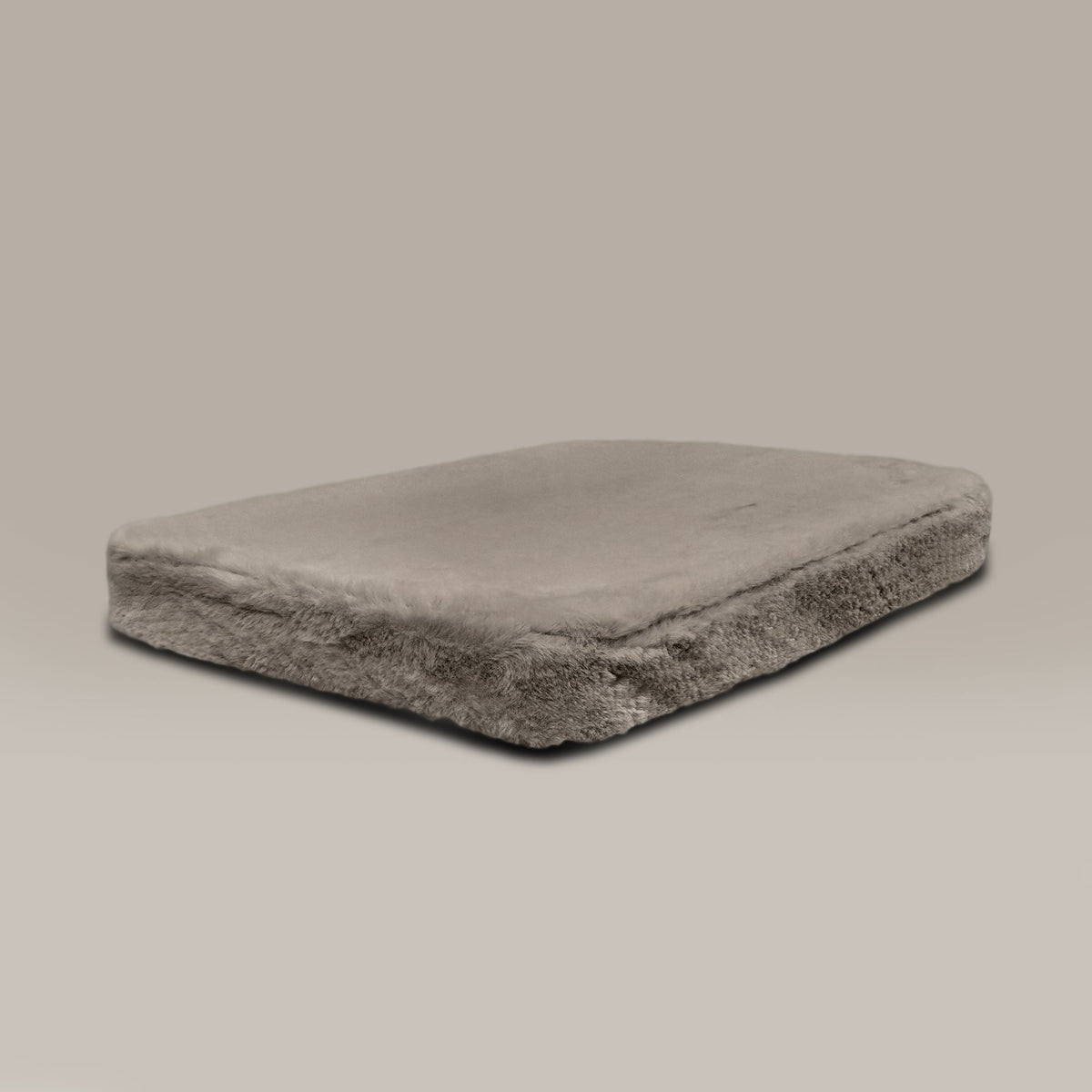 Rectangular dog bed on a beige background