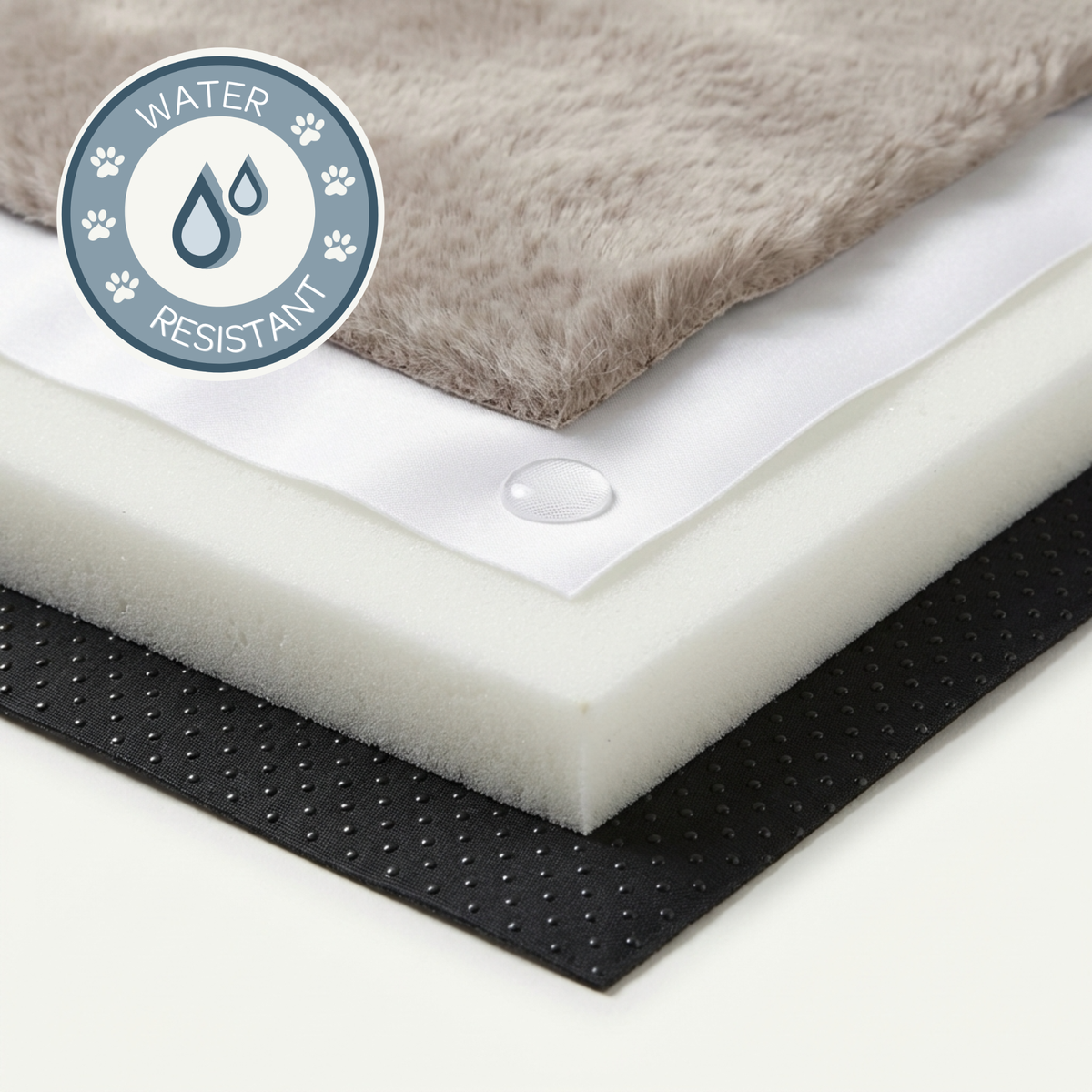 Close-up of a water-resistant mat with a water droplet on top, featuring a water-resistant label.
