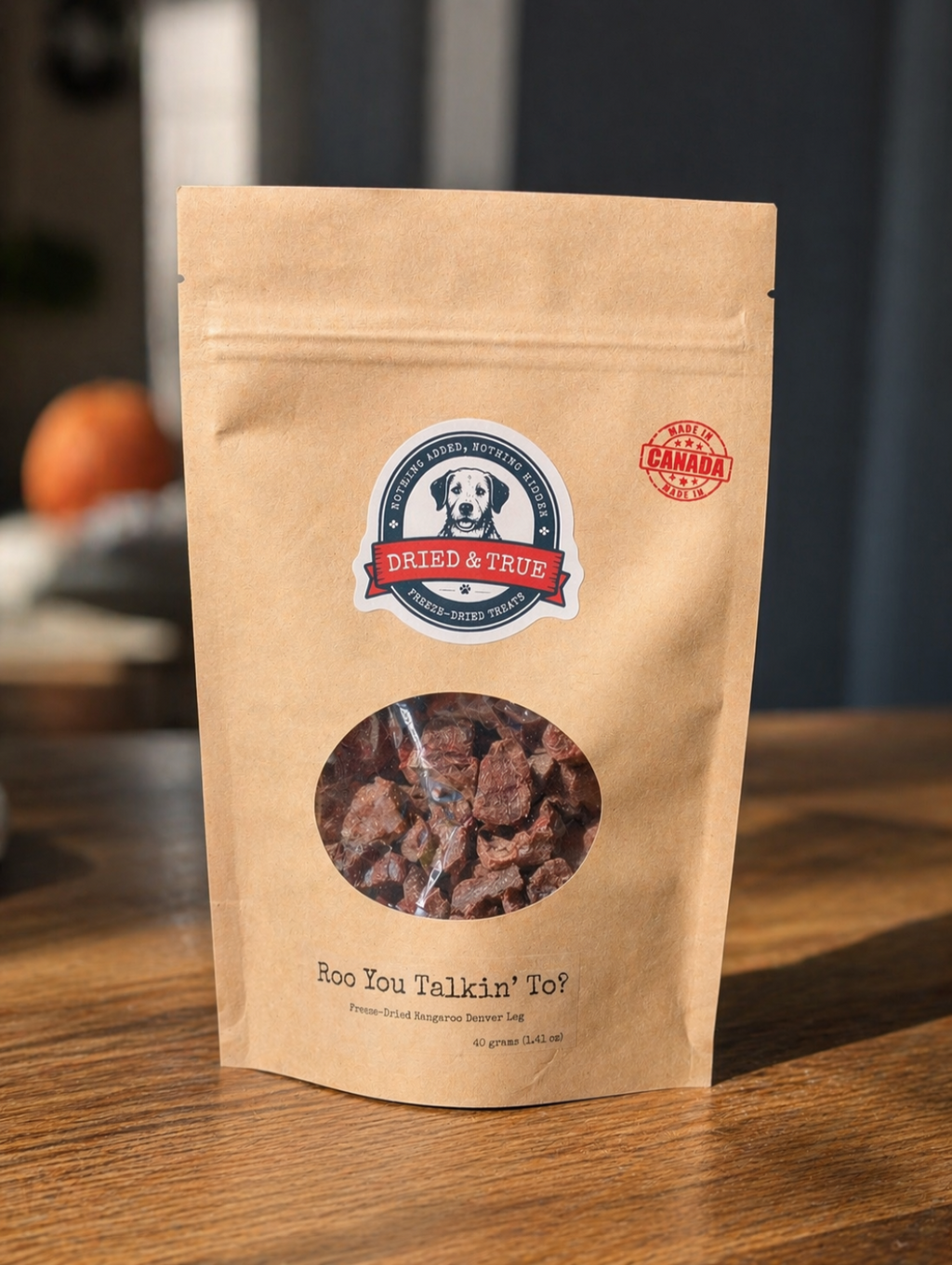 Kraft paper pet treat bag with brand logo on a wooden surface