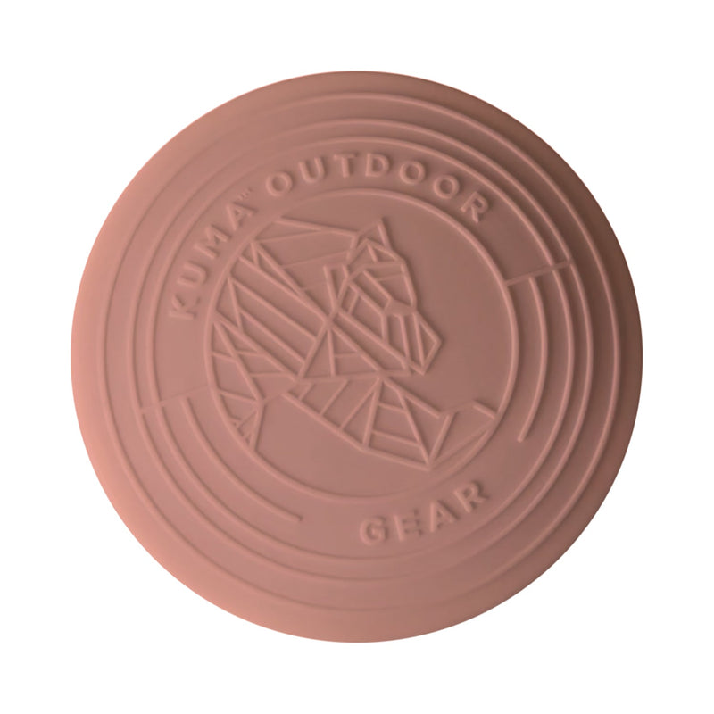 A round, light sage green outdoor disc with embossed branding for 'KUMA OUTDOOR GEAR' and a geometric mountain logo, shown on a plain white background.