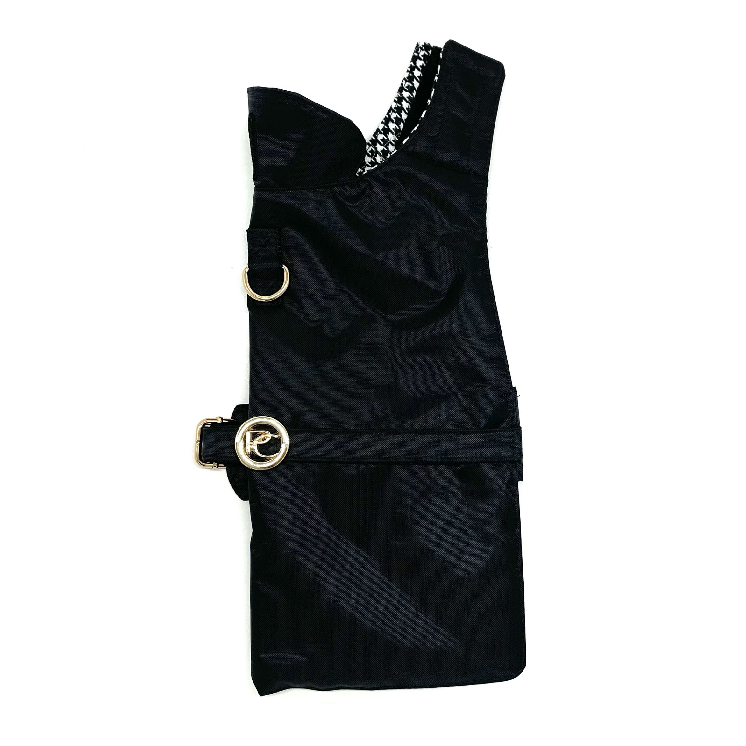 Black dog raincoat with gold buckles on a white background