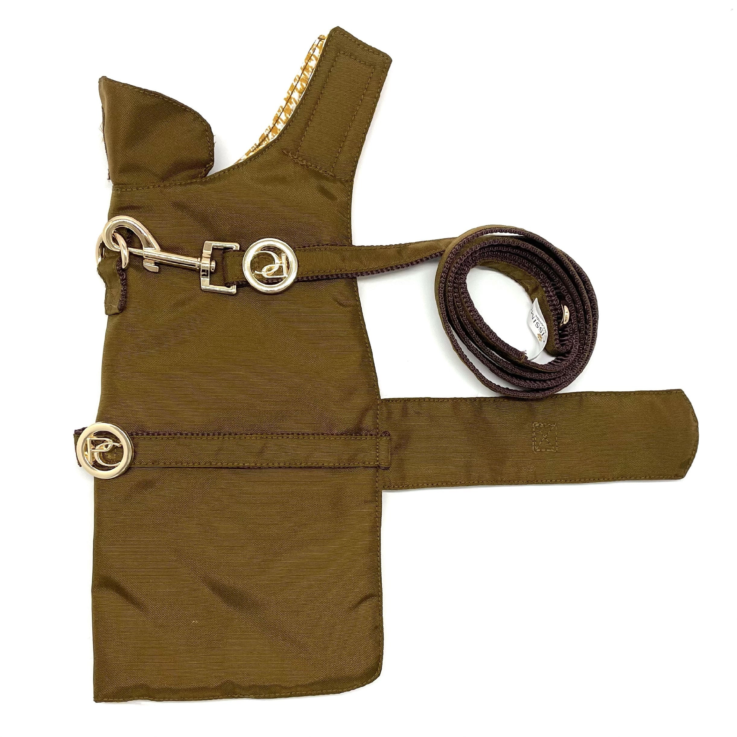 Gold dog raincoat with a leash on a white background