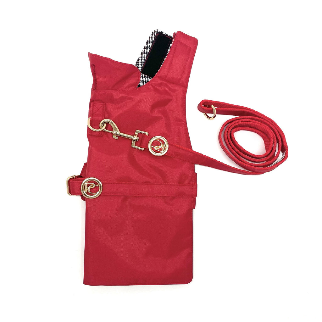 Red dog raincoat with a leash on a white background