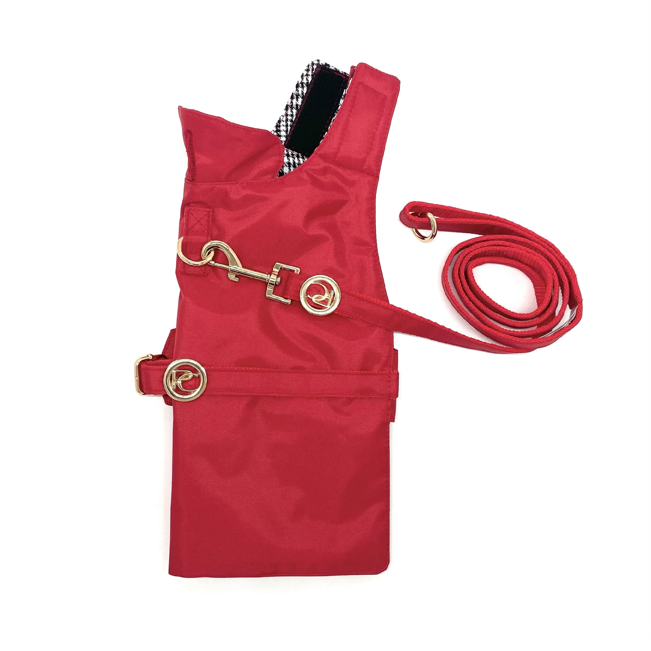 Red dog raincoat with a leash on a white background