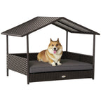 Dog lying on a rattan pet house with a roof