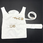 White dog raincoat with gold accents on a black background